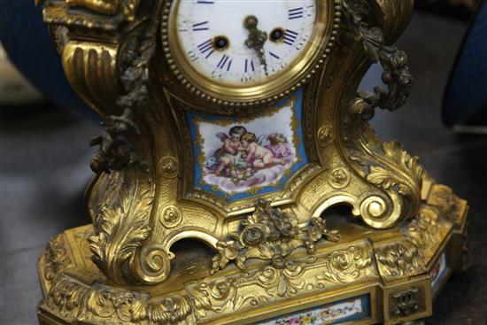 A 19th century French ormolu and Sevres style porcelain mantel clock, 21in.